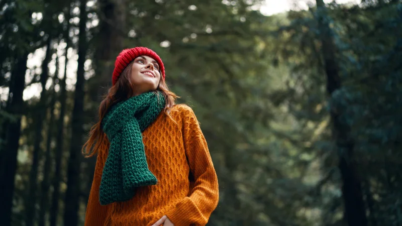 Top tips for mental health - Woman enjoying a peaceful walk in the forest