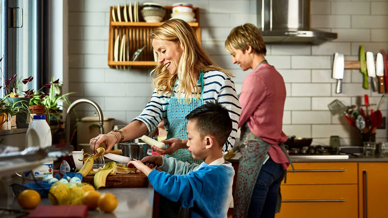 The Evolution of Paid Leave: Employer policies for today’s workforce - Woman-cooks-dinner-with-two-sons