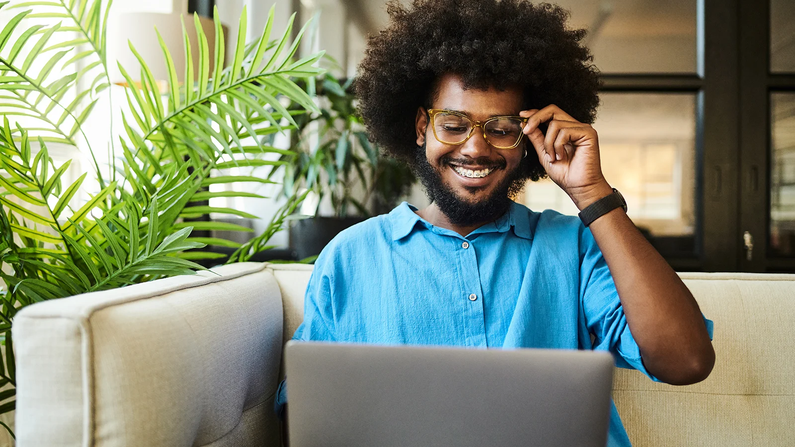 Man watching a webinar on his laptop.