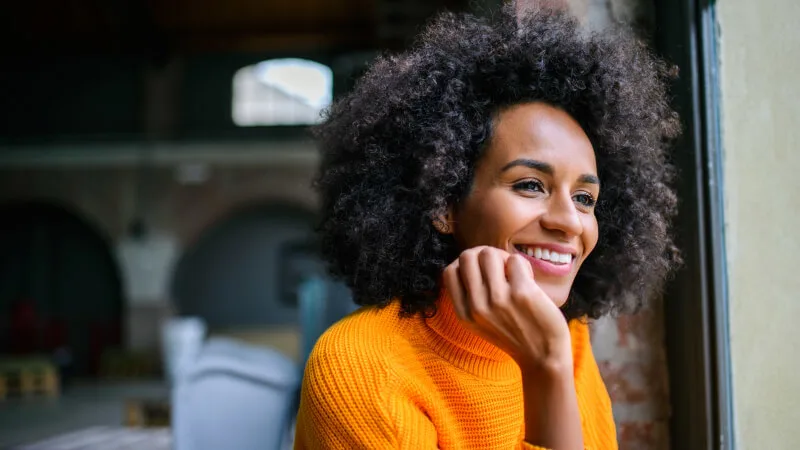 Woman smiling looking ahead