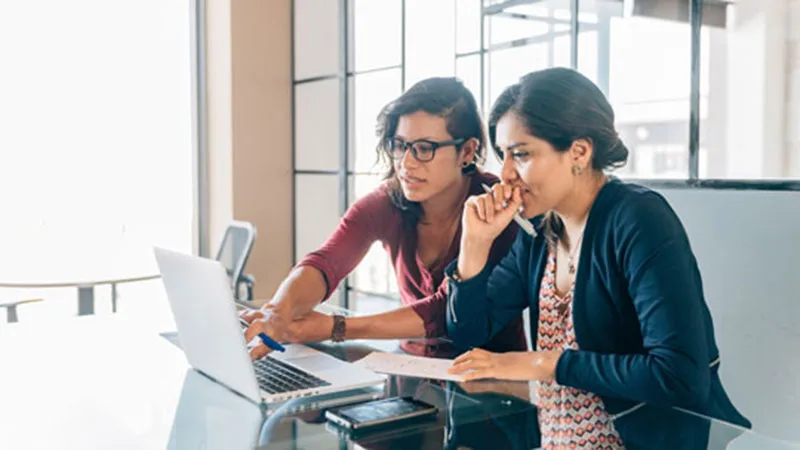 Developing Differently: Neurodiversity at work and at home - Two-women-look-at-laptop