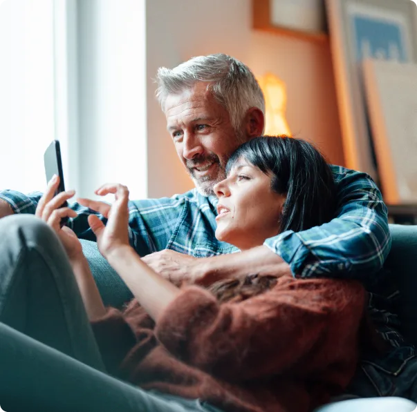 Man and Woman looking at smartphone