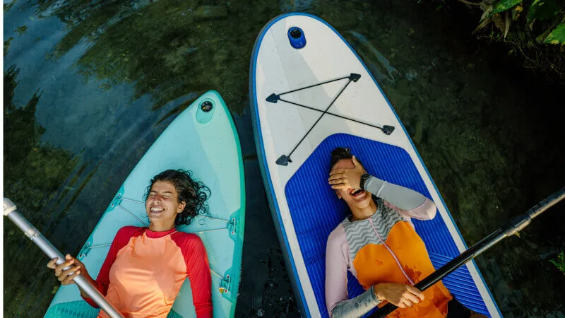 Steps to take for your physical health - Friends relaxing on paddle boards