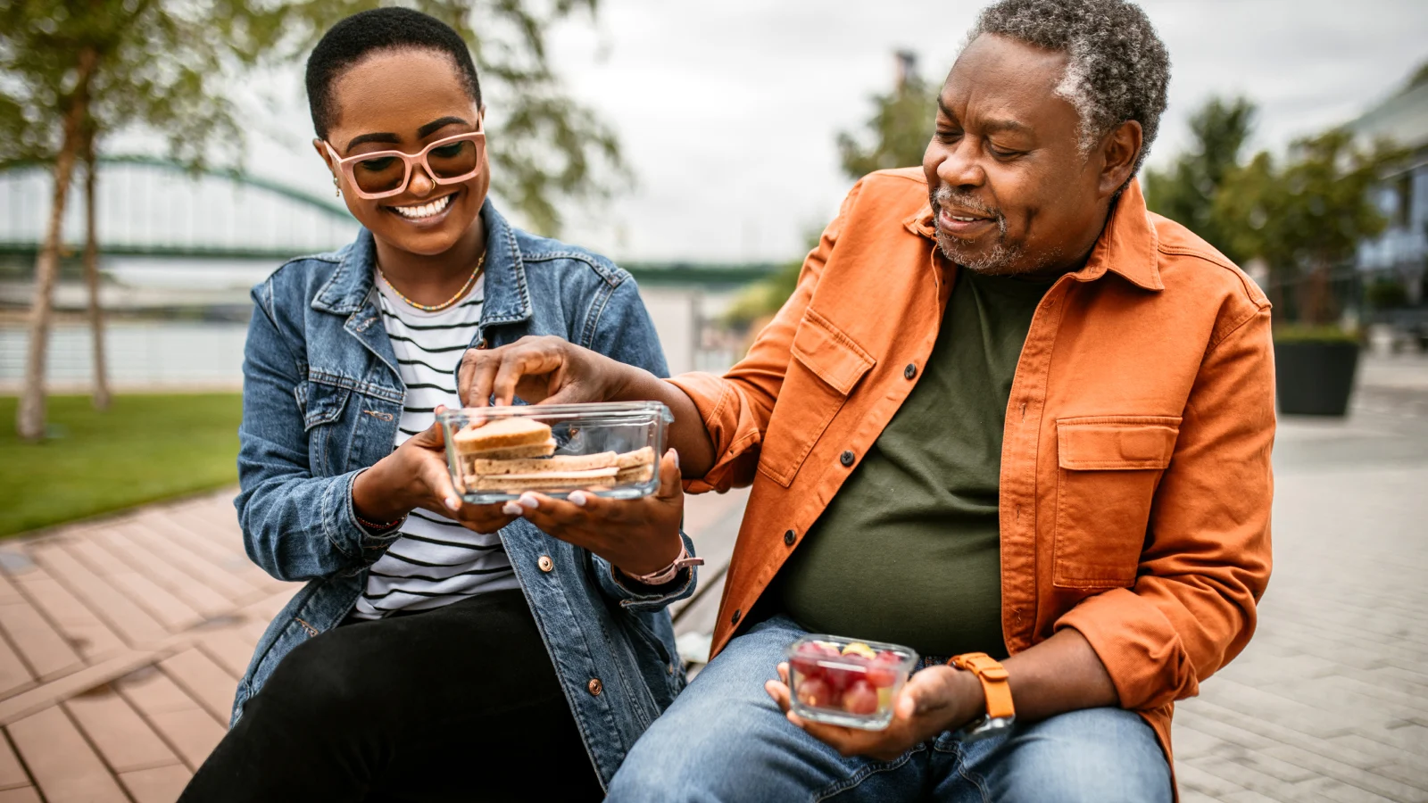 Retirement solutions - Adult and father eating at the park