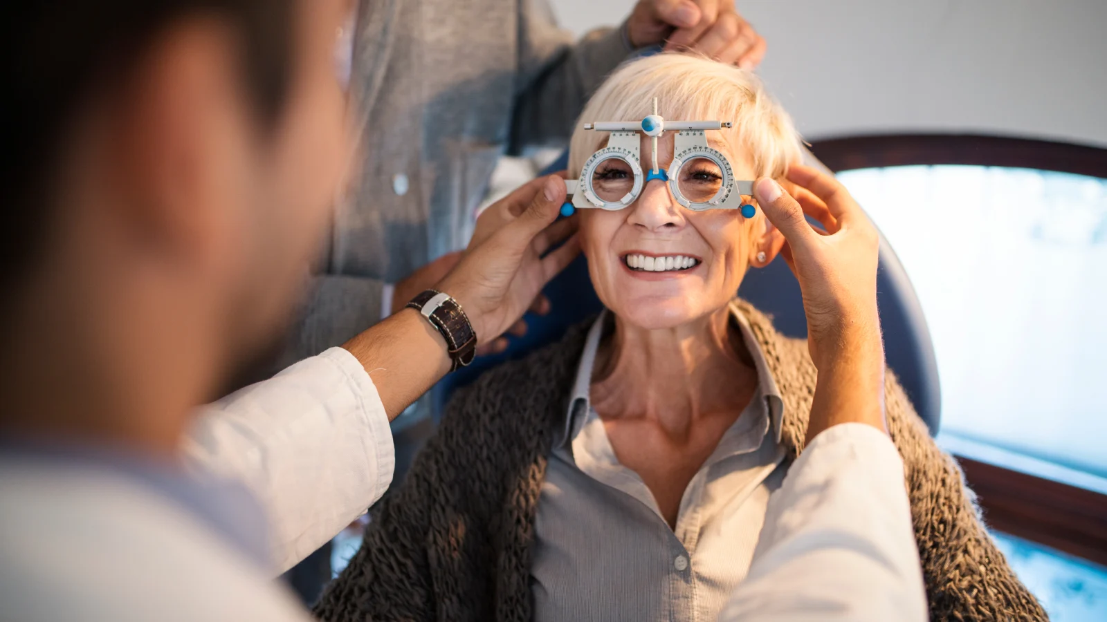 Retired woman getting an eye test at the opthamologist.