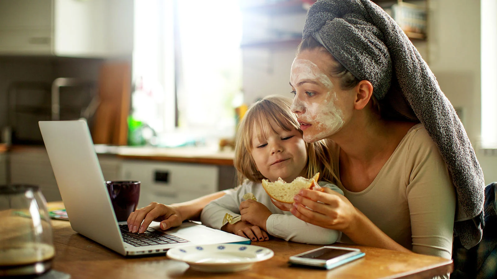 Mother and daughter having breakfast