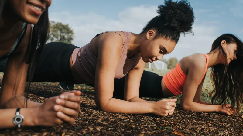 Steps to take for your physical health - Friends exercising outdoors