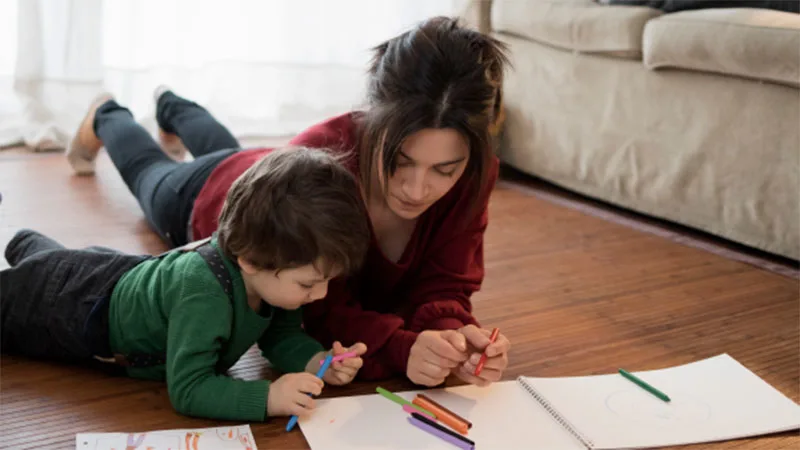 The Value of Leave Integration: Coordinating benefits plans and leave policies contributes to improved outcomes - Woman and son coloring together