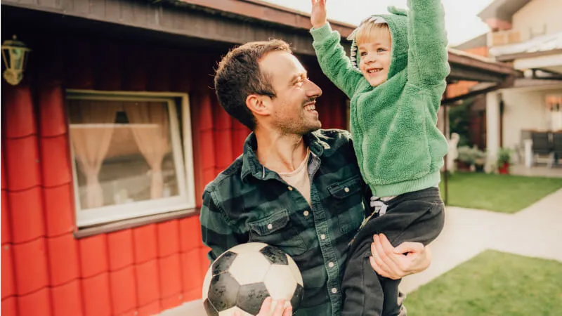 Father and son celebrating soccer win