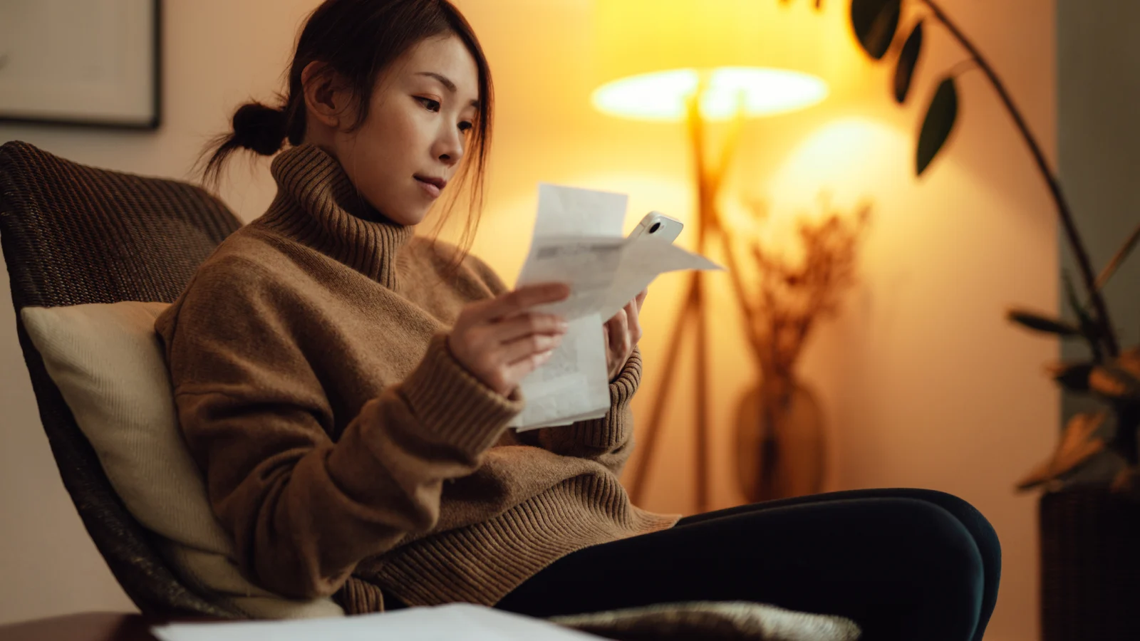 Woman reading bills