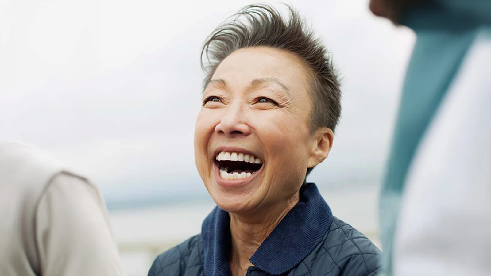 The connection between oral health and overall health card - Older woman with a great smile