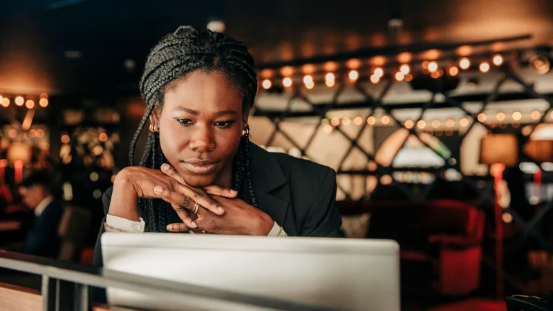 Leadership - Woman in a leadership training program looking at her laptop