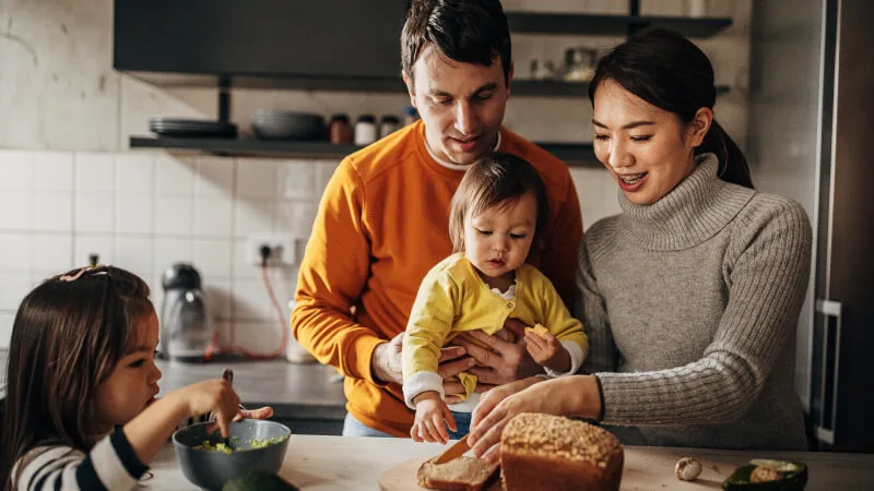 Universal life insurance - Family in kitchen together