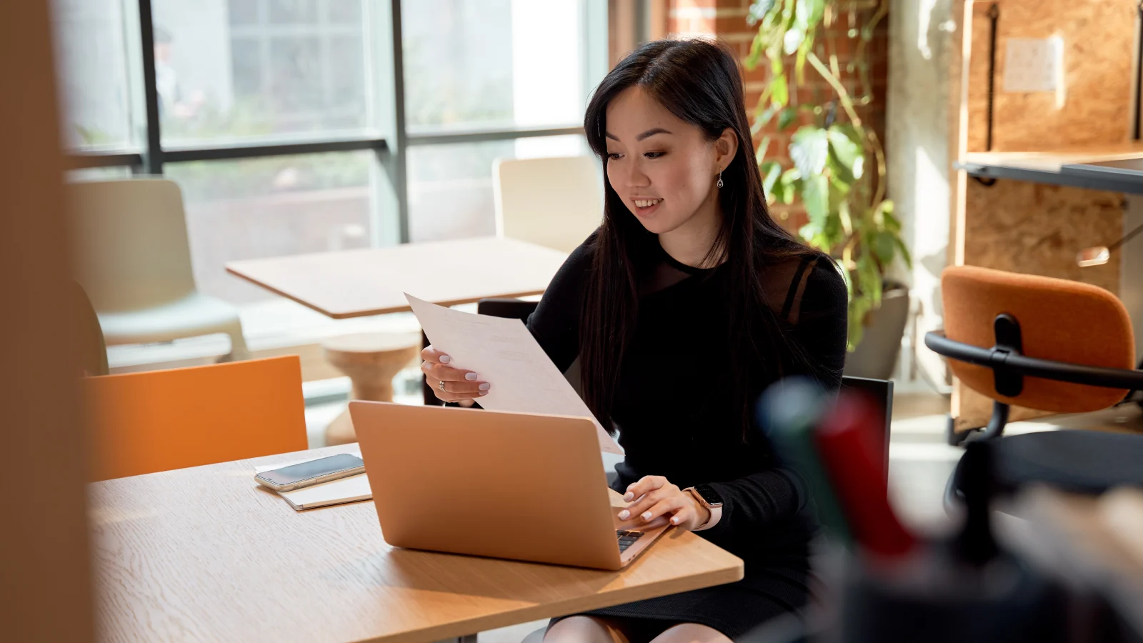 Woman sitting in modern office