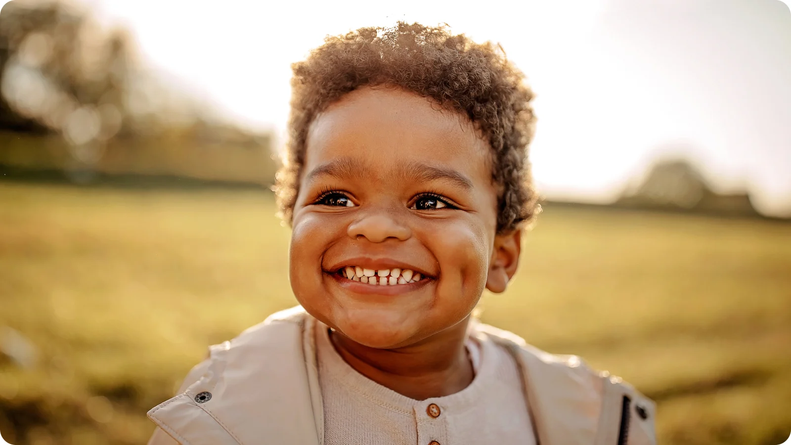 Cute little boy smiling with teeth