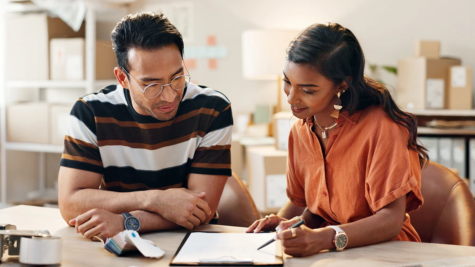 man and woman reviewing notes