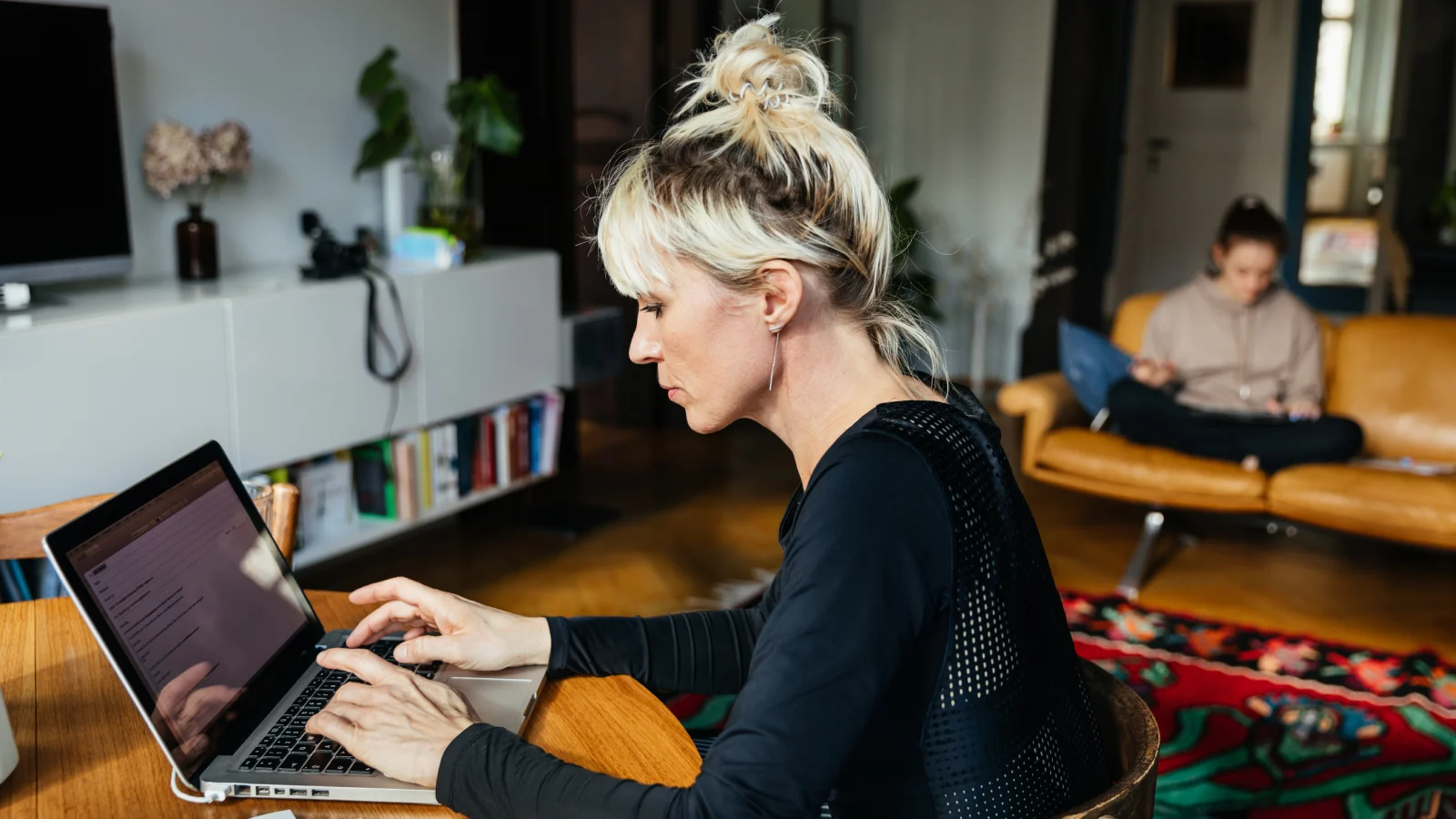 Women accessing digital support on her laptop.