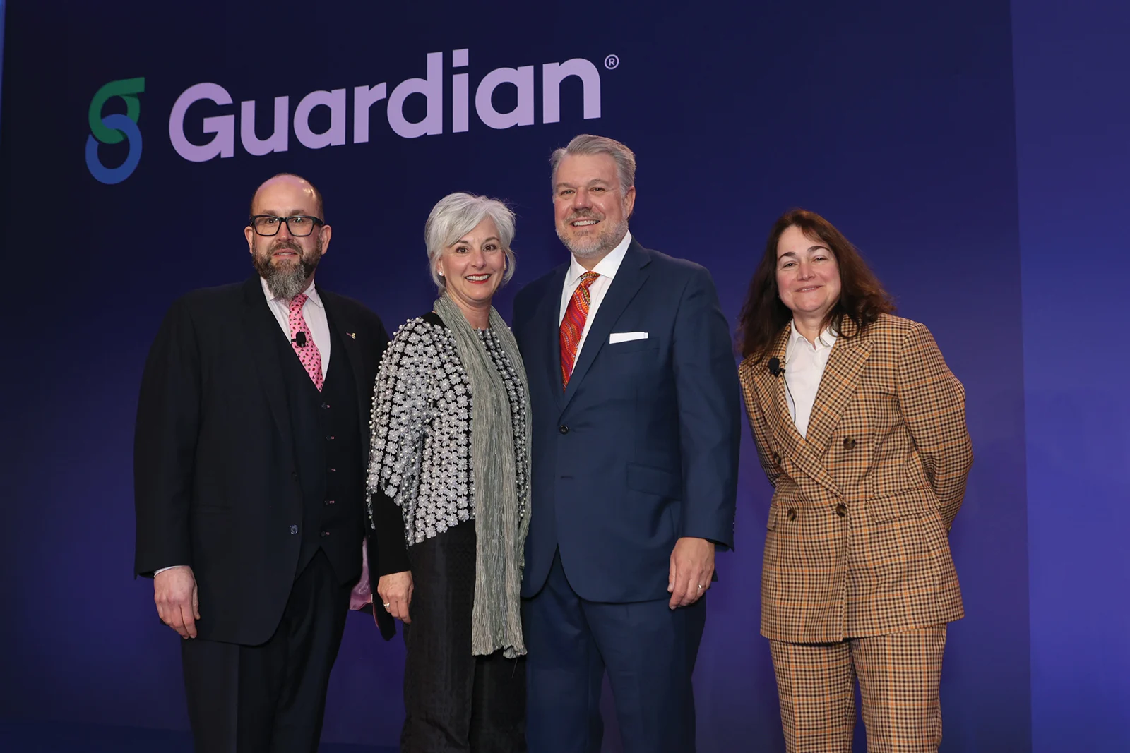 Retiree Andy Meehan and his wife, Catherine Meehan, joined by Dan Ellen on the left and Leyla Lesina on the right