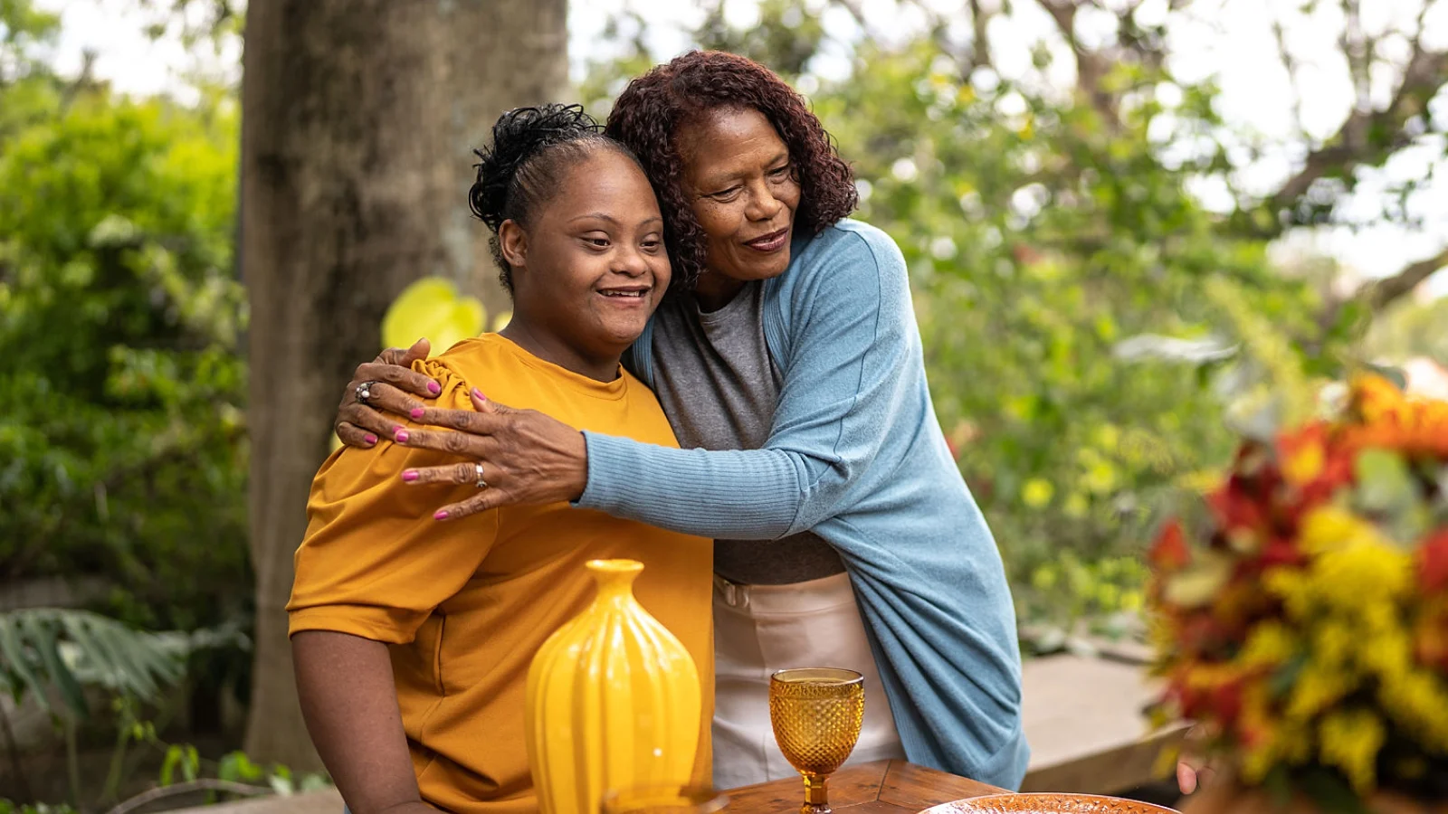 Loving mother embraces daughter