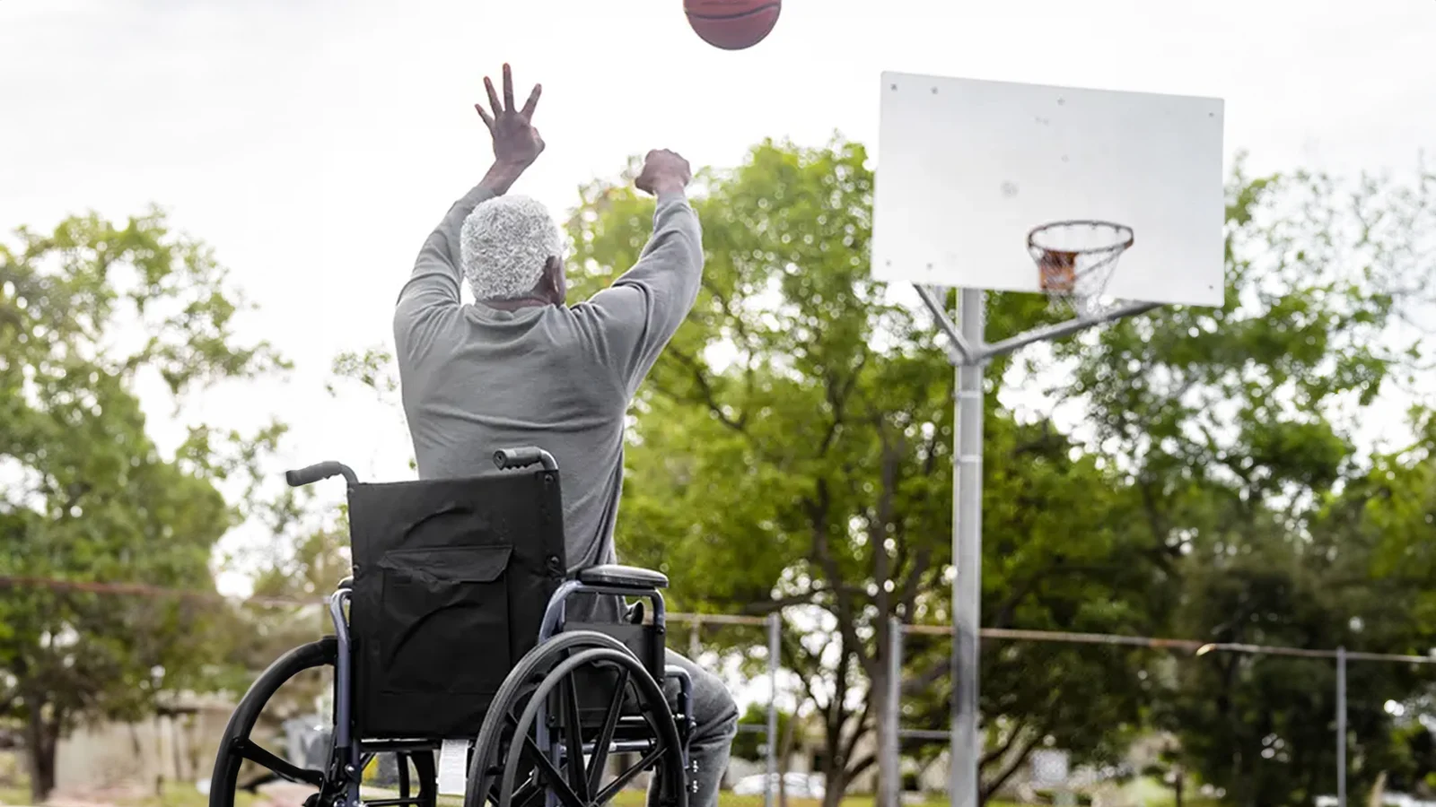 What is short term disability insurance? - Man in a wheelchair shooting a basketball