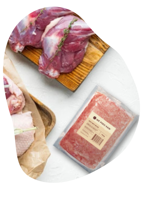 We Feed Raw package with a cut of fresh lamb alongside