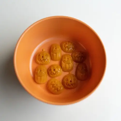 Orange bowl with Pumpkin toppers