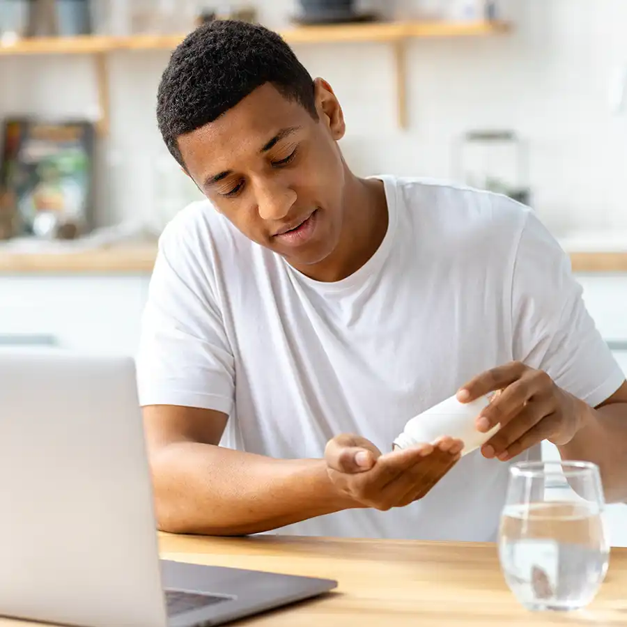 a man taking vitamins