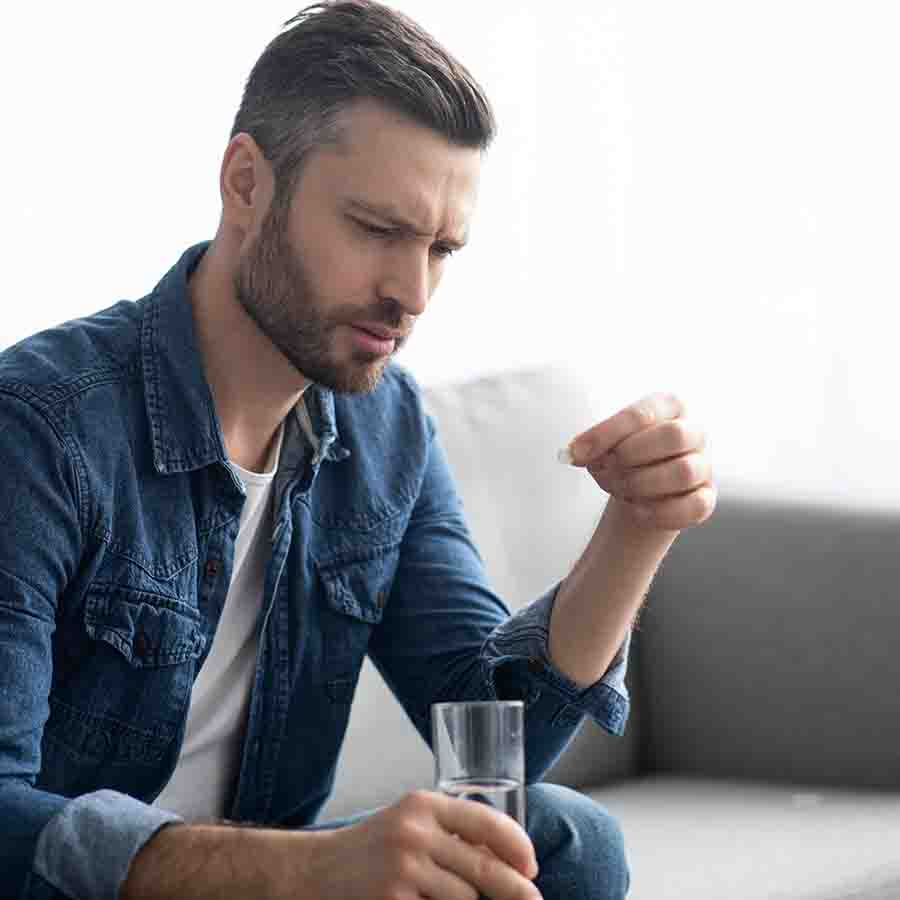 a man taking medication