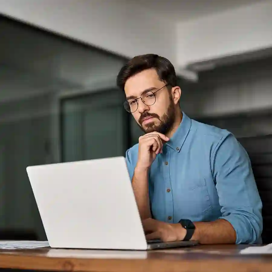 A man looking at his laptop