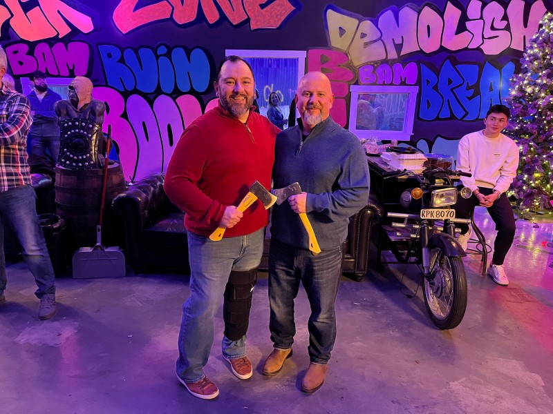 An office celebration featuring team bonding and a little friendly competition with axe throwing.