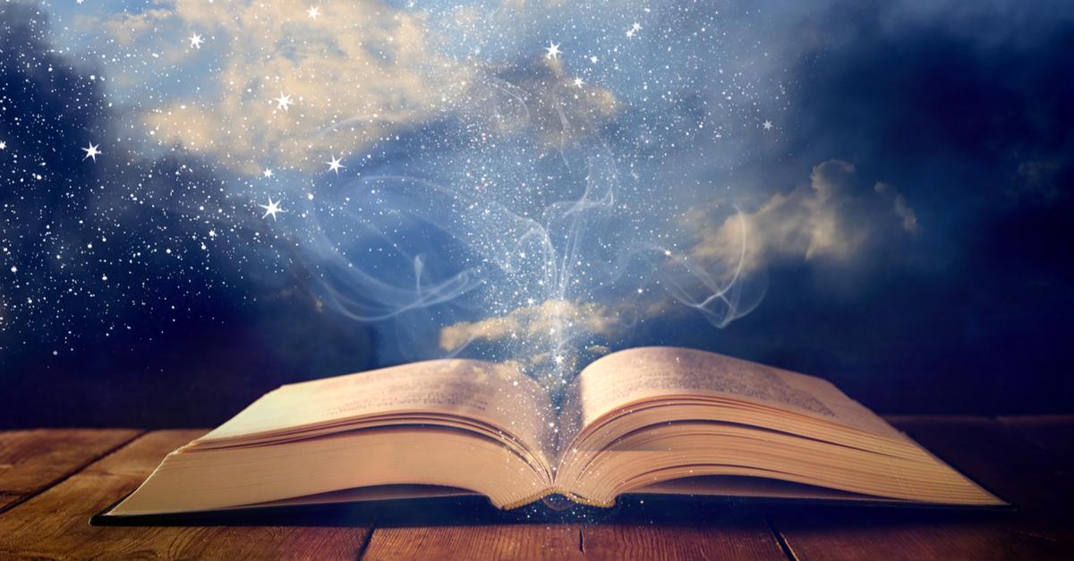 open book with stardust and smoke