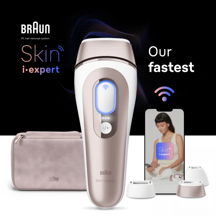 Centered IPL device, behind it a beige pouch, a mobile device with Skin-i-Expert app and three attachments