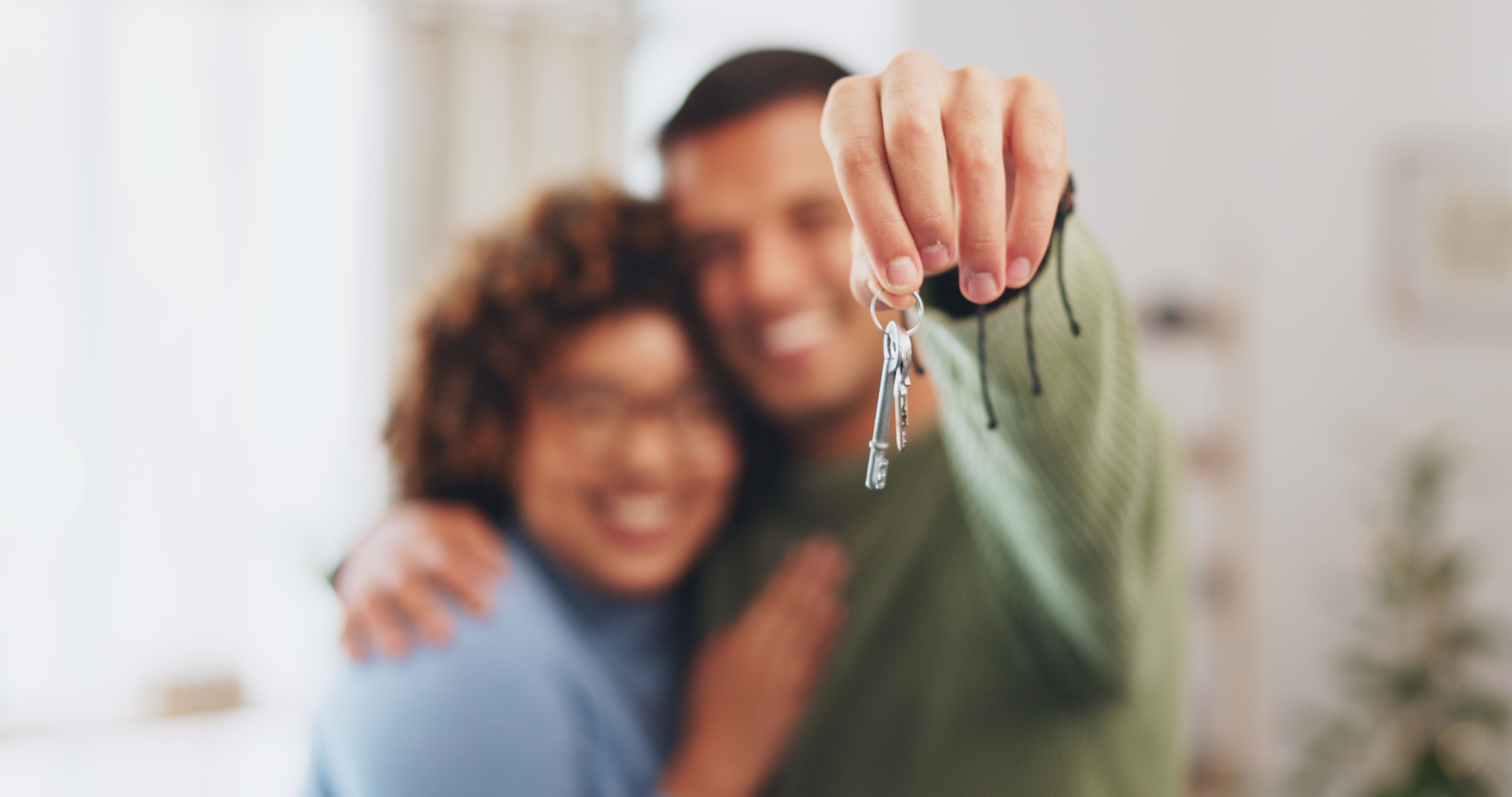 blurred-couple-getting-keys