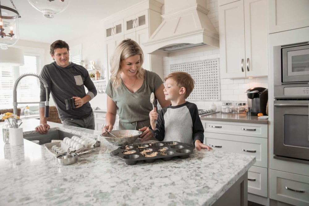 family-baking-muffins-in-new-home-kitchen_gettyimages-e1556553232856