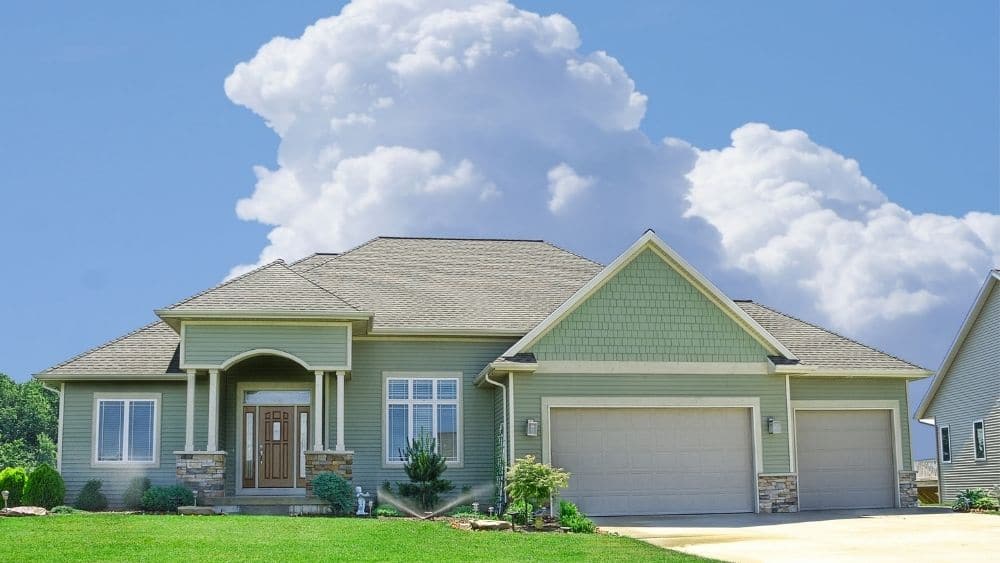house with green vinyl siding.