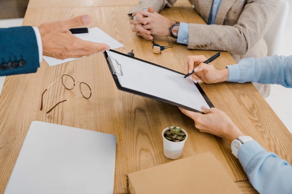 individual-signing-a-contract-on-an-ipad