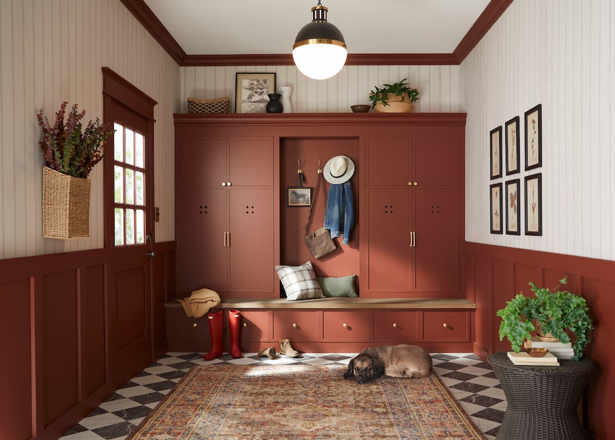 Mudroom with built-in bench in a  mudroom, painted in Warm Mahogany, Glidden's Paint Color of the Year for 2026, a warm red with brown undertones