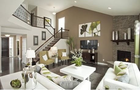 A Gathering Room framed by a staircase and stone fireplace. The Eden plan by Pulte Homes. The Reserve at Chesterfield Village – The Crossings. Chesterfield, Mo.