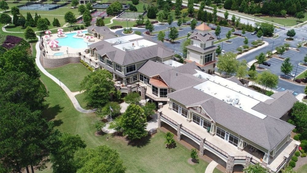Aerial view of a community center and pool.
