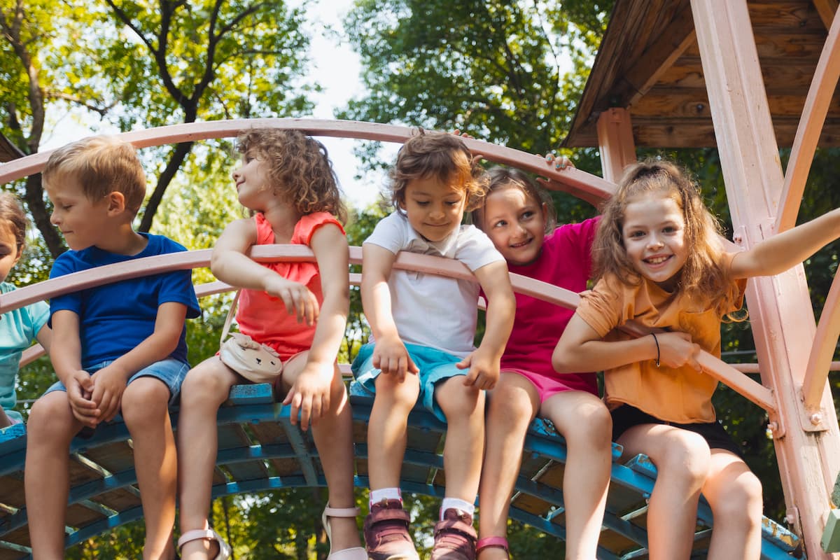 Kids sitting on a climber in a playground