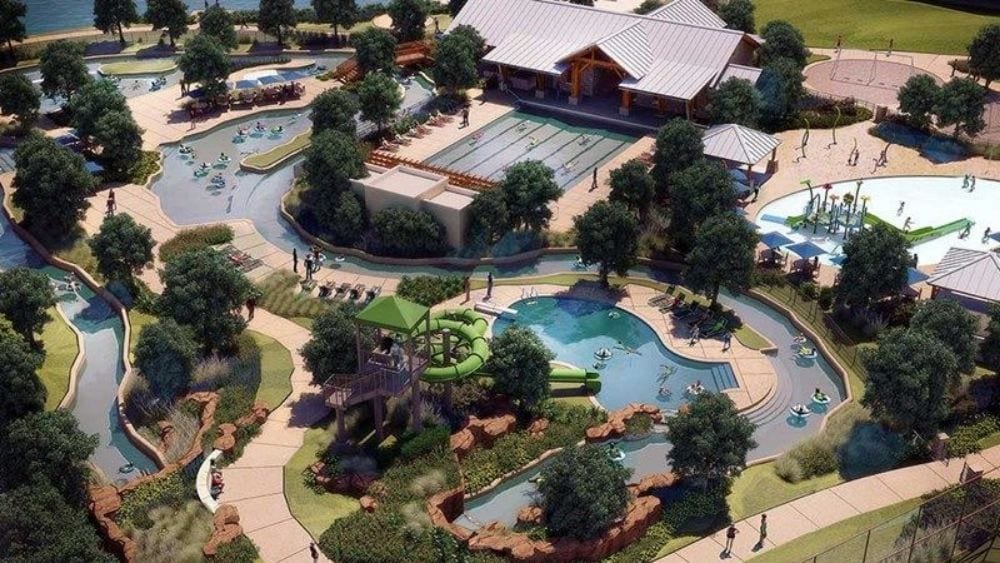 Rendering of a community pool with trees and buildings.
