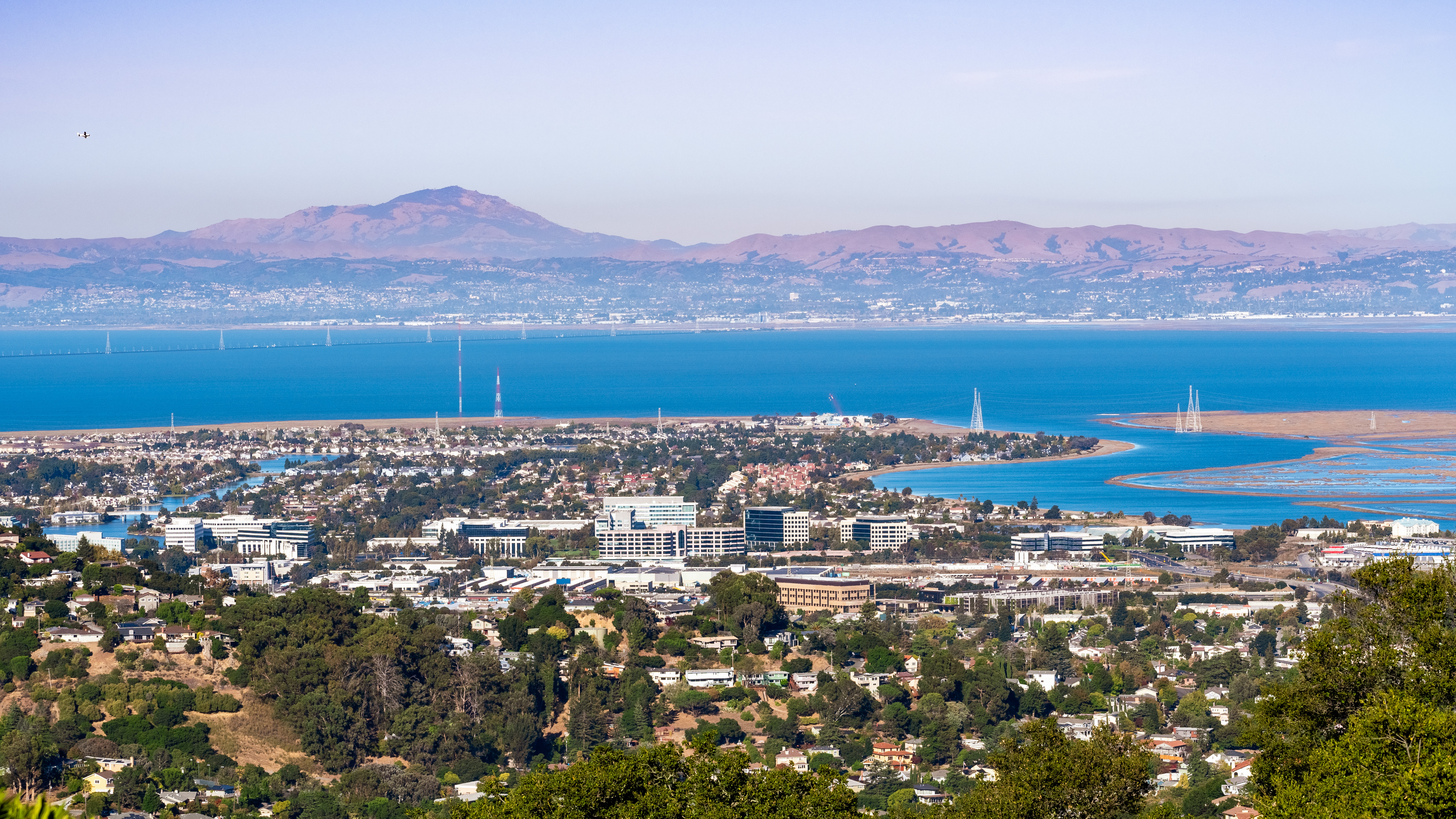 aerial view of shoreline of San Carlos with mountains in the background