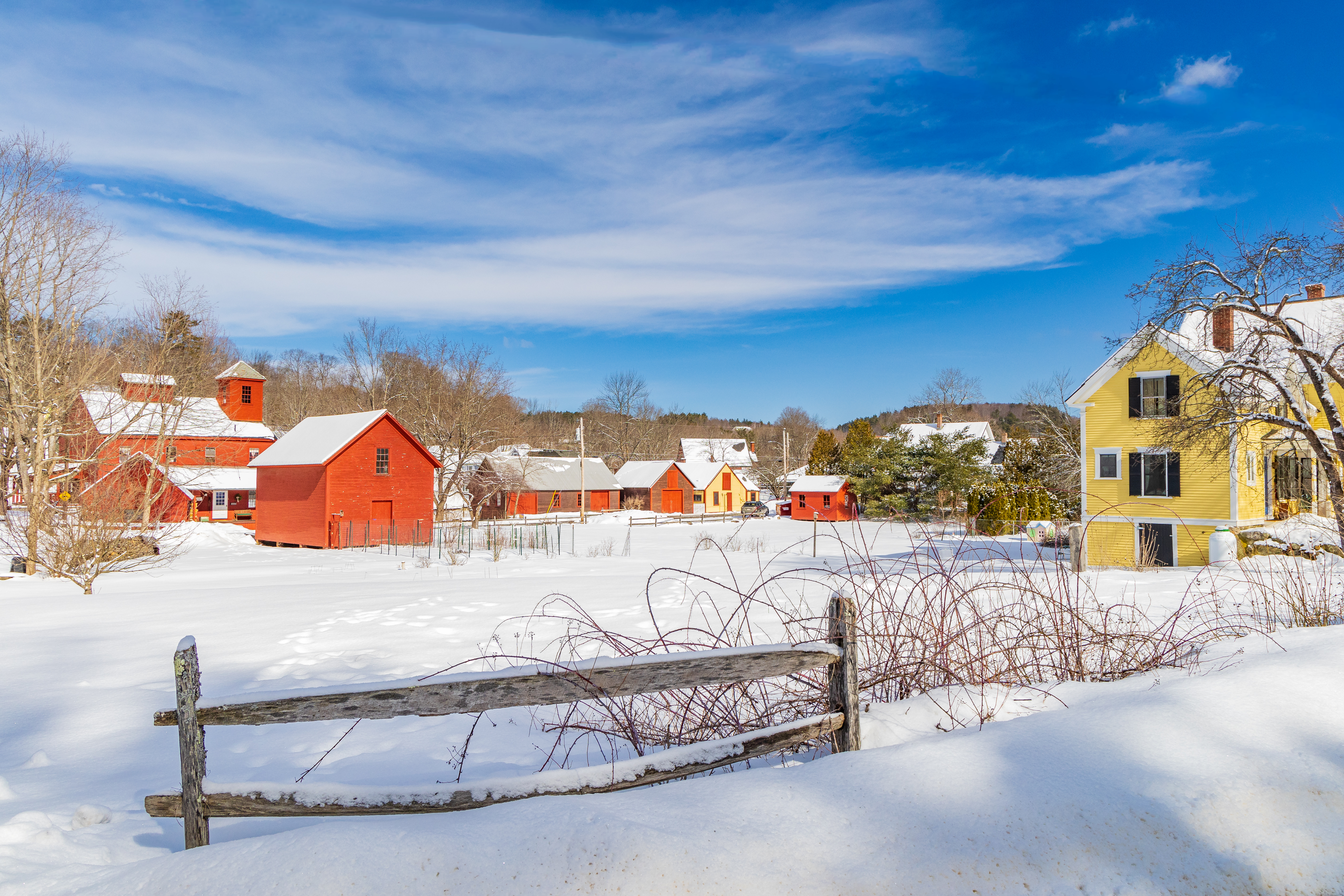 Snowy New Hampshire countryside with colorful homes