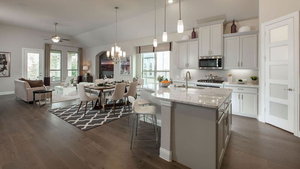 Modern open-concept living room and kitchen space.