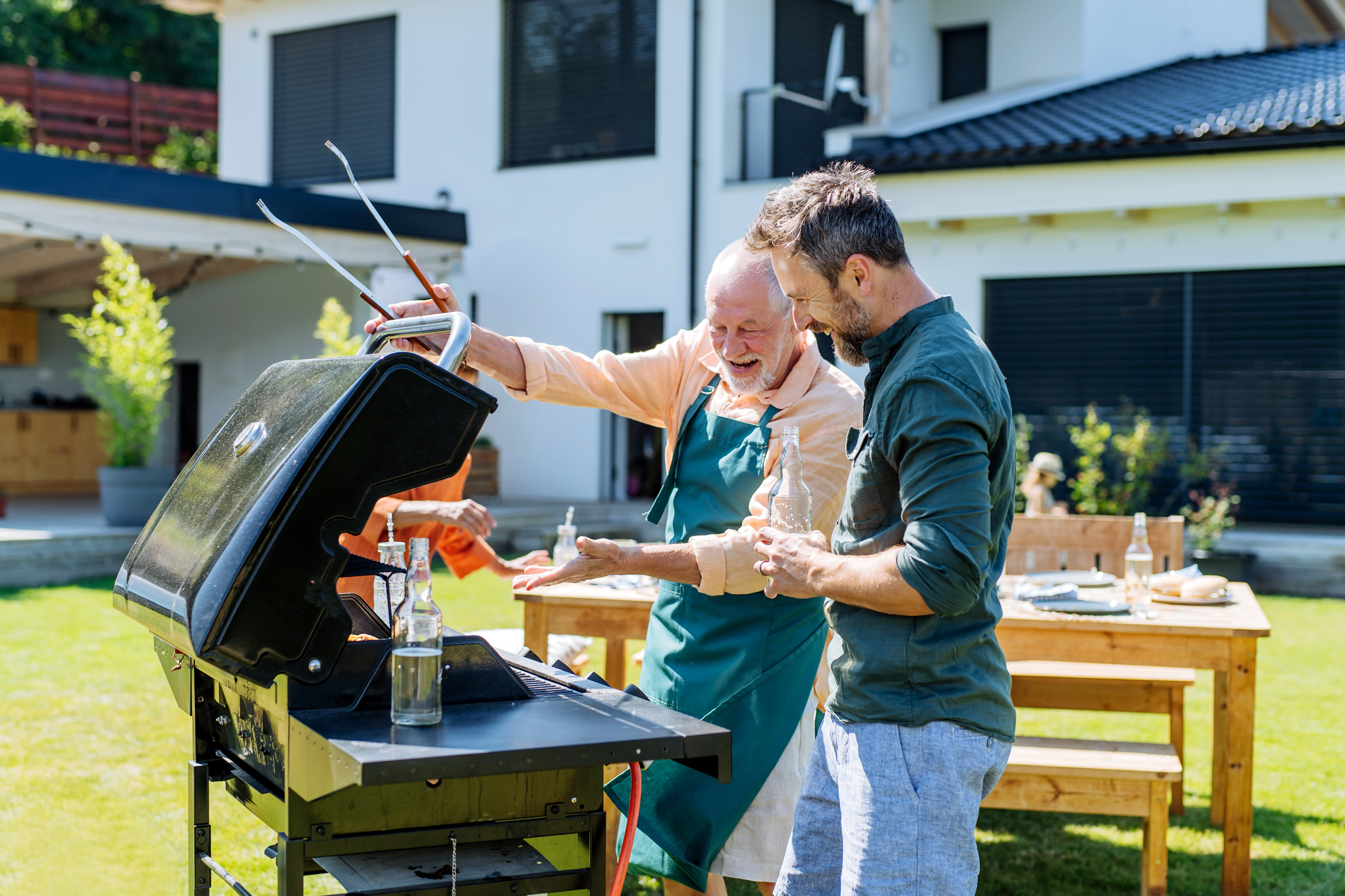 senior-dad-son-grilling