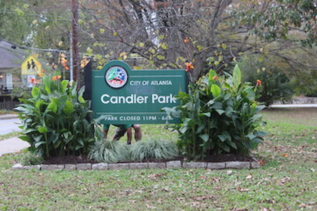 Landscaped entrance with sign to Candler Park 