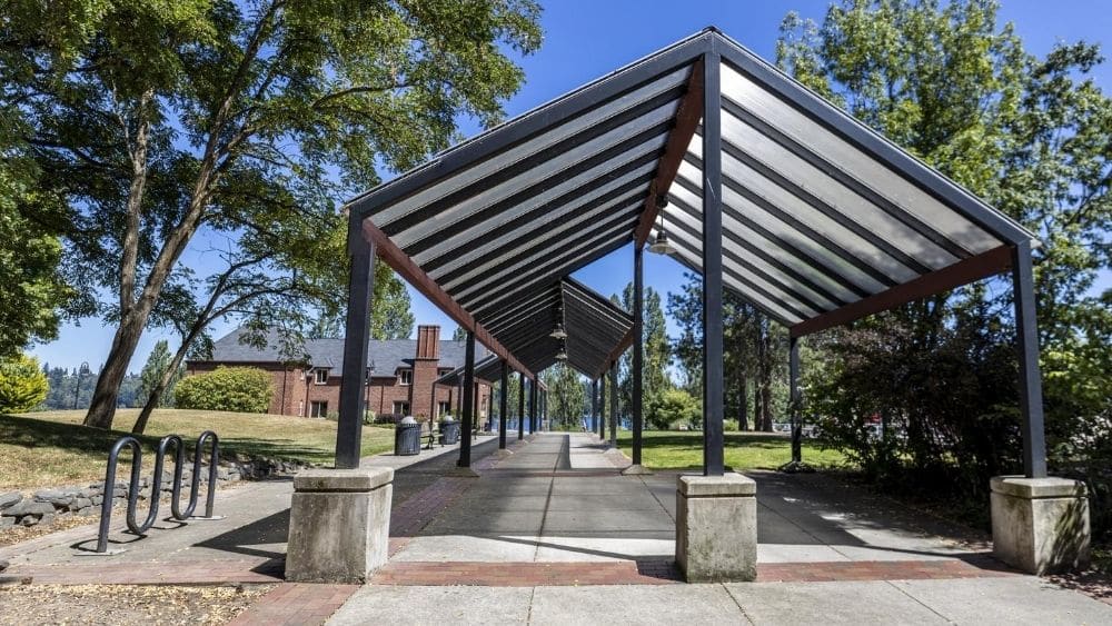 Metal pagoda at the entrance to a park.