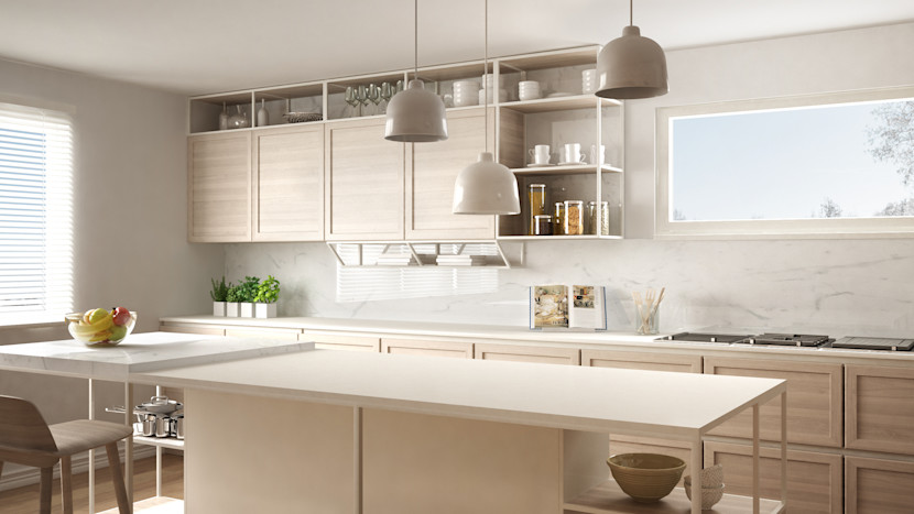 Kitchen island with built-in seating and countertops at different heights, with flat panel cabinetry