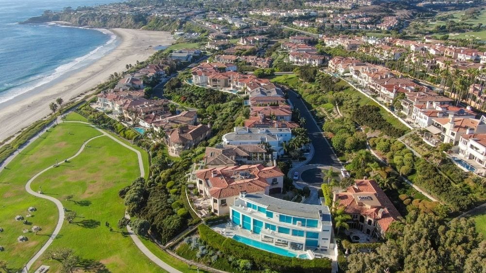 View from above of a suburb situated along a beach.