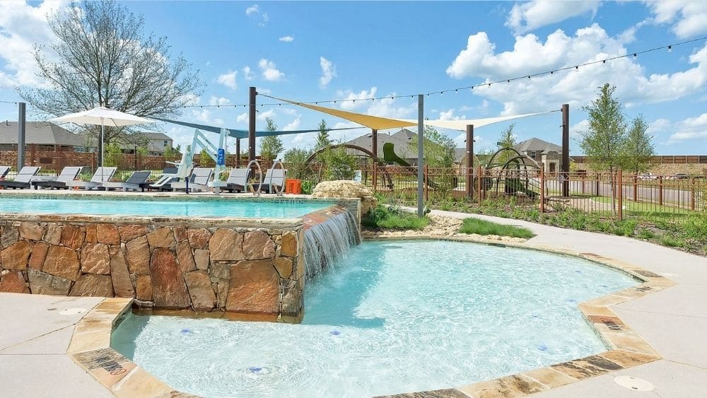 Community pool with a small waterfall.
